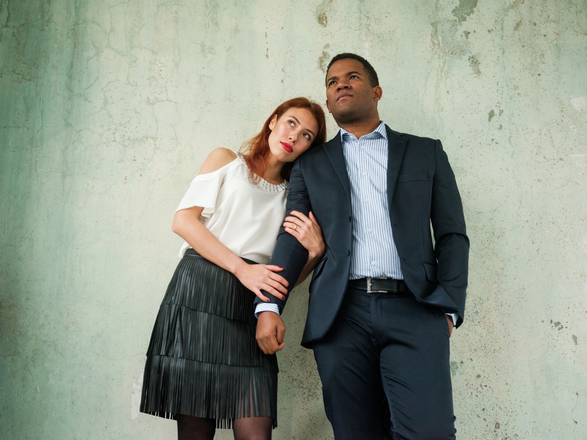 Dressed up engagement photo in editorial setting
