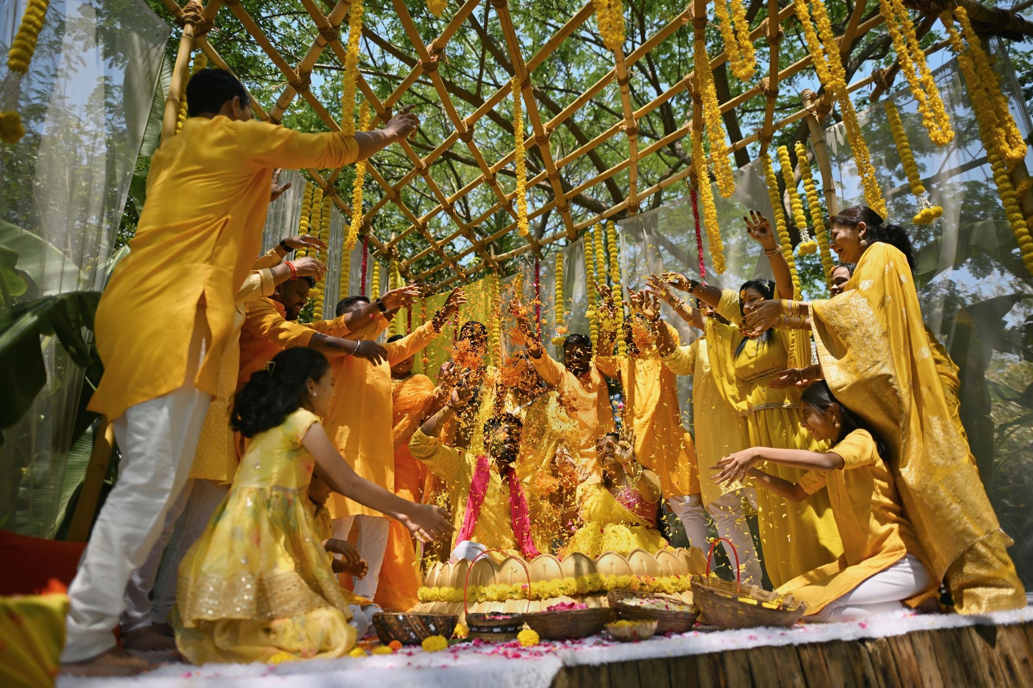 Family showering the couple with flower petals