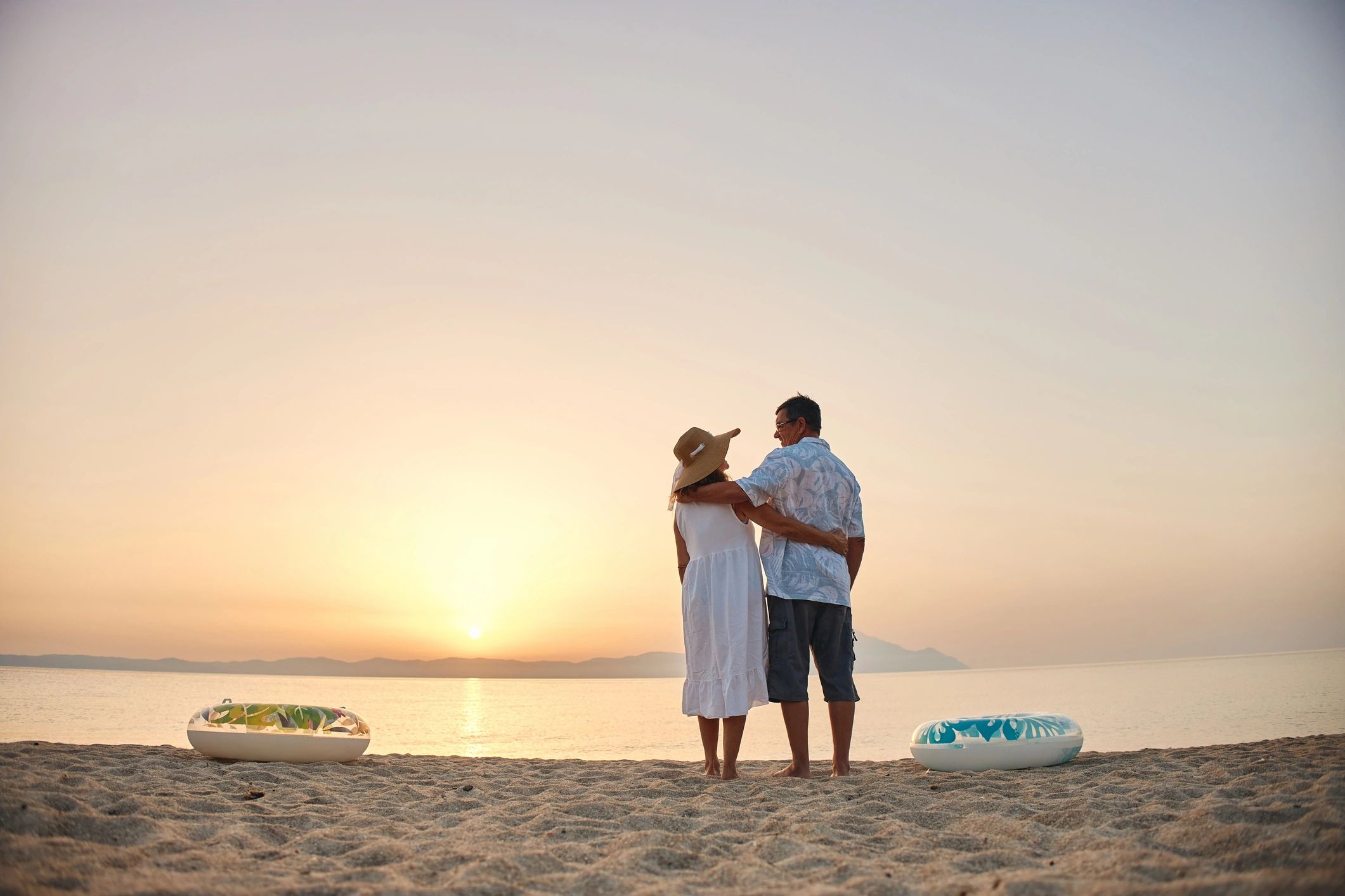 Couple embracing at sunset on the beach
